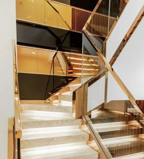 Beige Marble Staircase With Gold Metal Handrail Beige Marble Staircase With Gold Metal Handrail